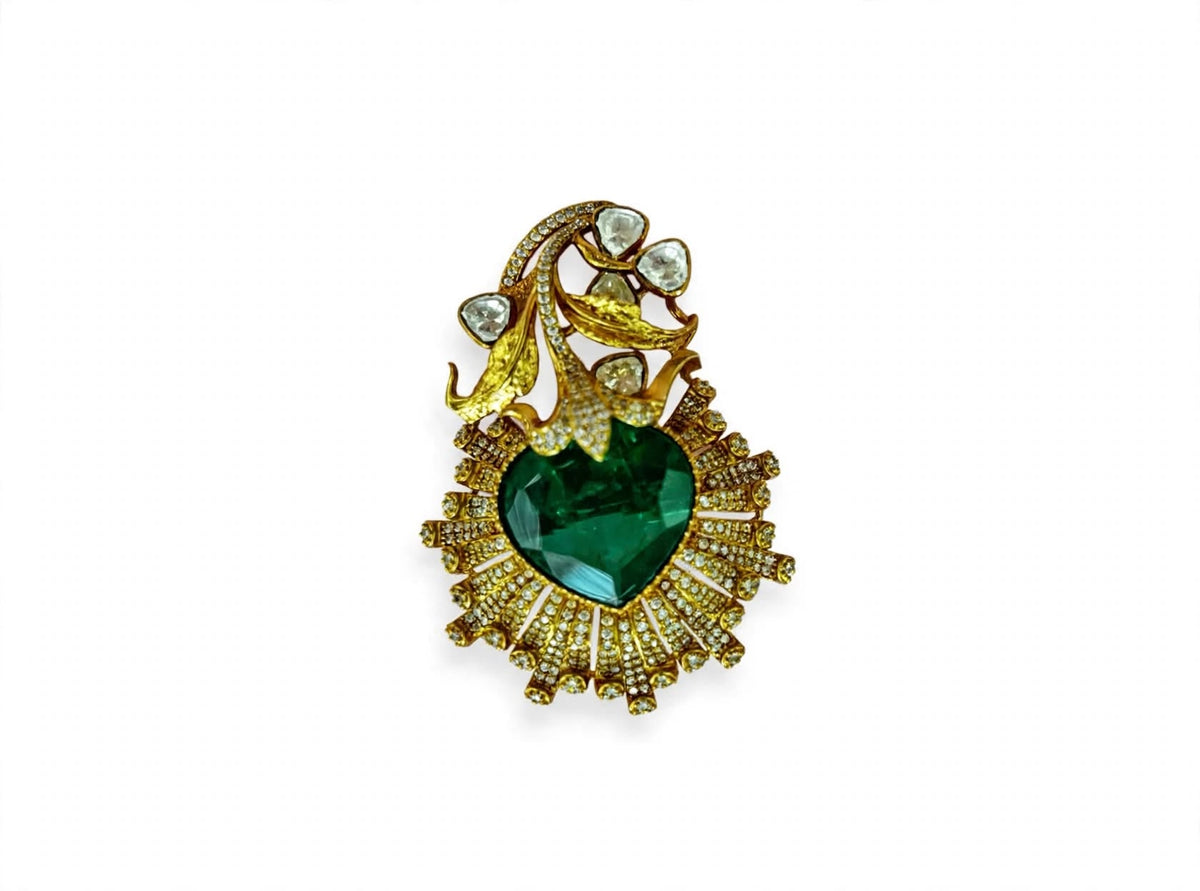 Antique gold Polki Kundan brooch pendant with heart-shaped emerald green stone and floral vine detailing
