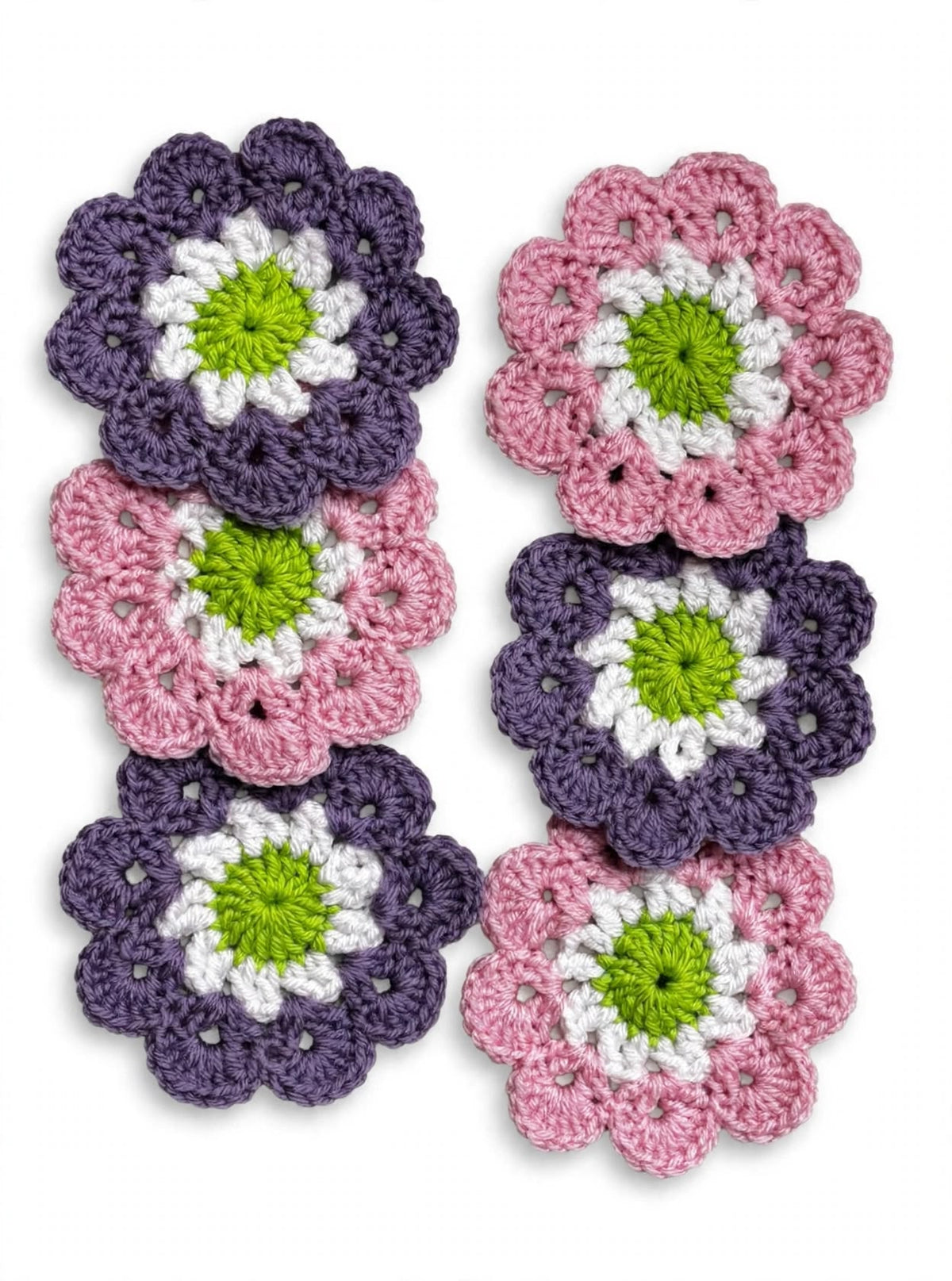 Set of 6 handmade crochet flower coasters in purple and pink with white petals and green centre
