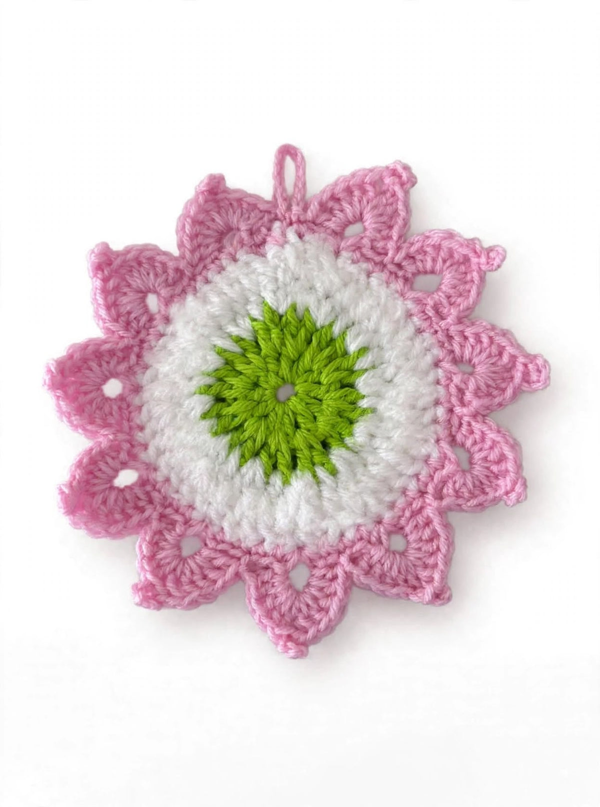 Handcrafted pink crochet flower keychain with white center and green core