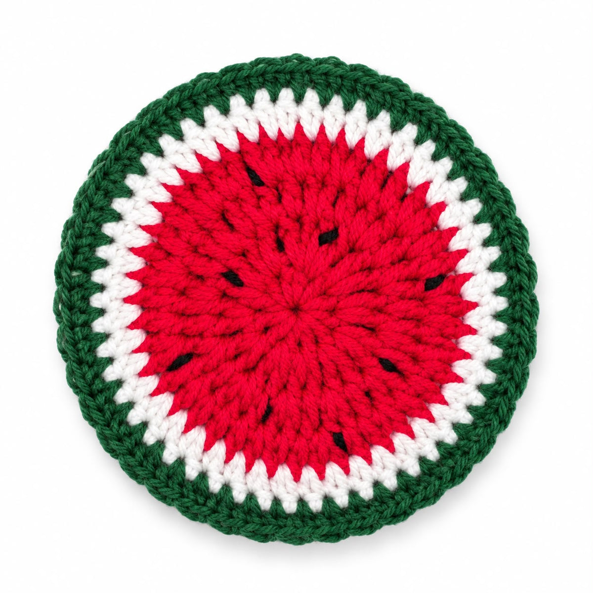 Handmade crochet watermelon coaster with green border, white ring and red center with black seeds