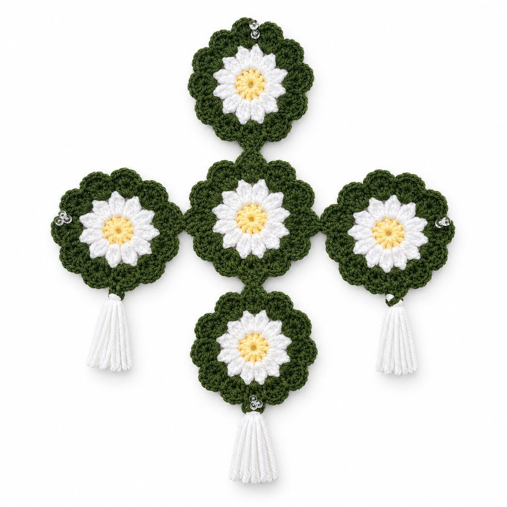 Handmade crochet daisy wall hanging in olive green with white petals and yellow centers, white tassels and crystal beads